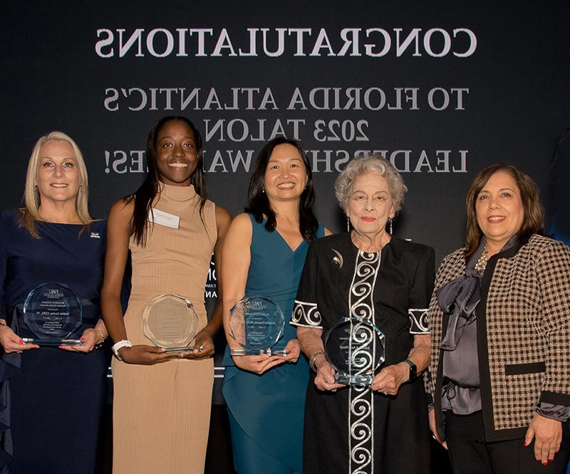 president volnick with talon award recipients